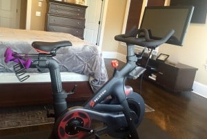 Peloton spin bike with touchscreen and weights