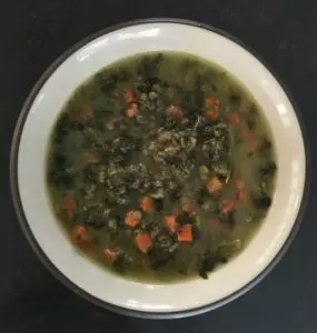 Lentil Kale Soup Splendid Spoon in a white bowl