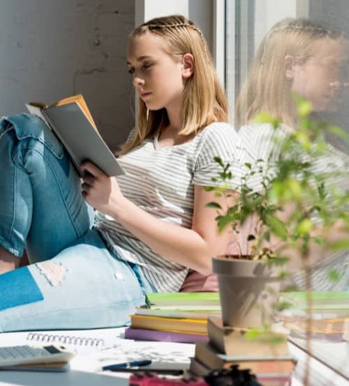 teenage girl reading book