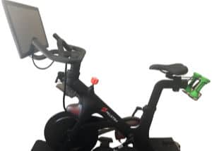 Peloton spin bike with green weights