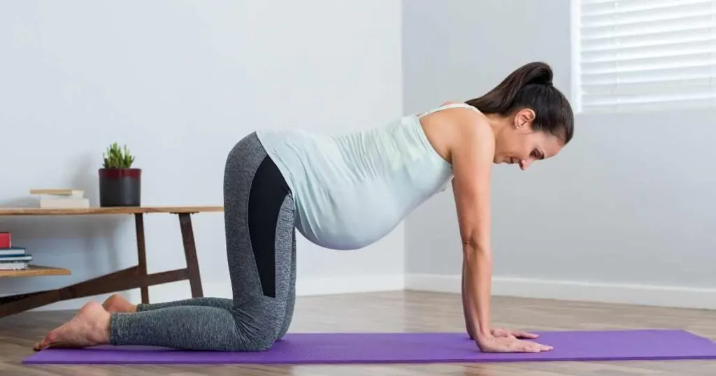 pregnant woman practicing yoga