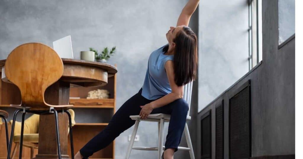 woman practicing chair yoga