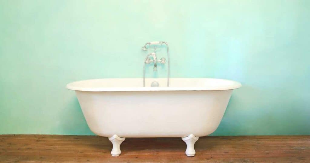 clawfoot bathtub blue wall