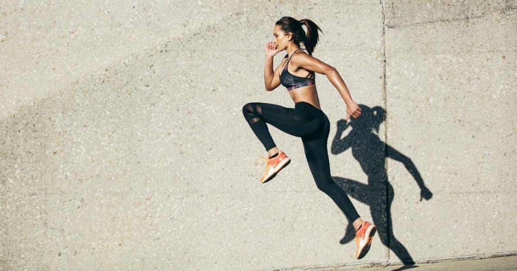 woman running shadow on wall