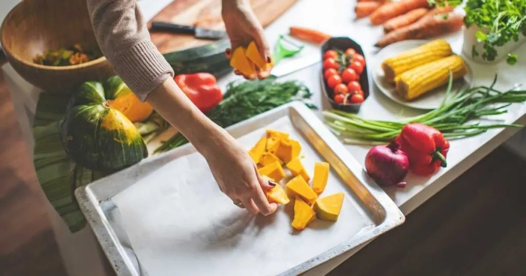 woman preparing roasted vegetables