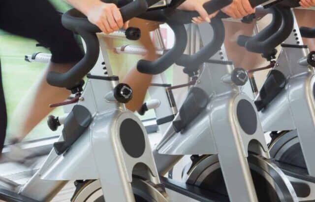 indoor cycling bikes in a row