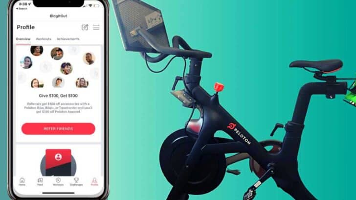 peloton bike next to iphone referral blue background