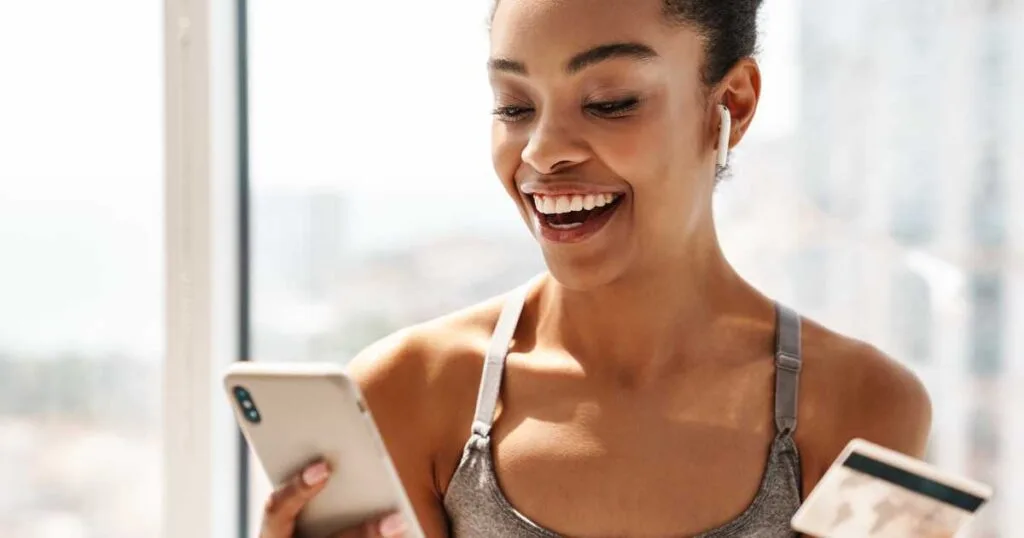 fit woman shopping on phone