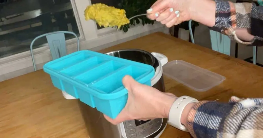 serving split pea soup into aqua colored Souper Cubes tray