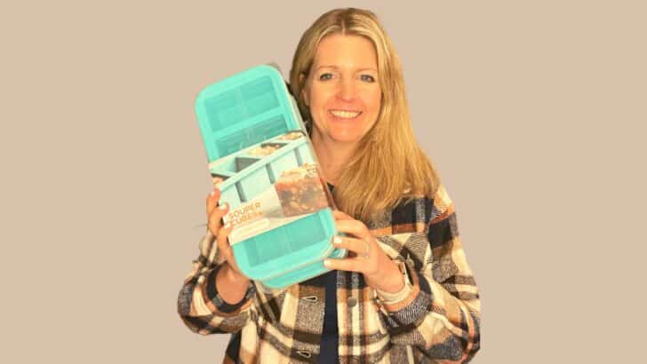 woman holding aqua souper cubes silicone tray
