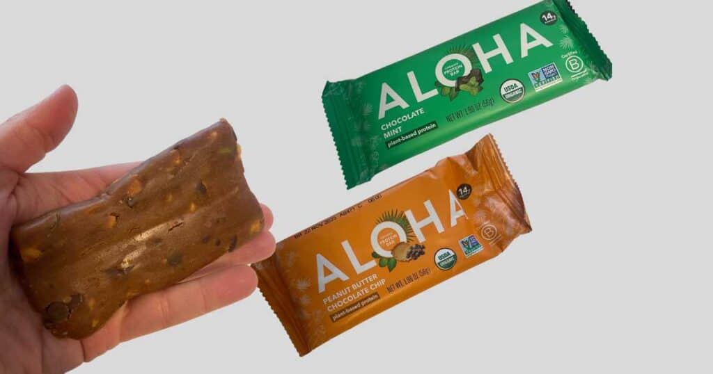 hand holding aloha bar chocolate mint and peanut butter chocolate chip