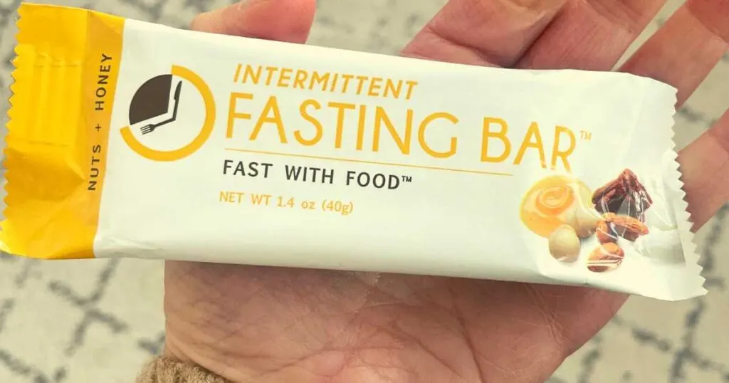 hand holding Nuts and Honey Prolon Fast Bar