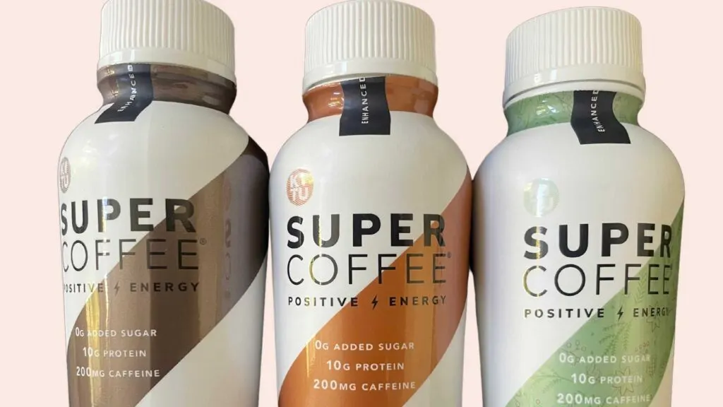 close up look of super coffee bottles light pink background