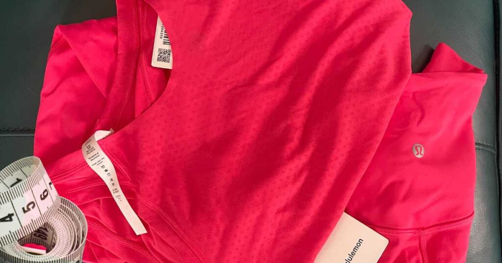 bring pink lululemon clothes next to tape measure