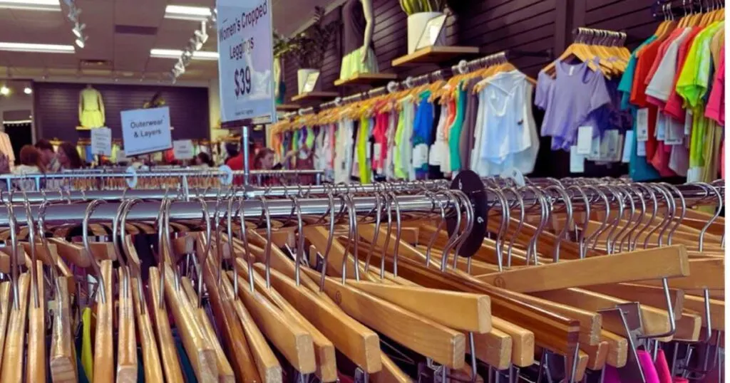 lululemon outlet racks of hangers and sign