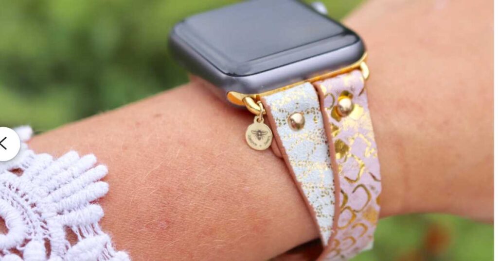 criss-cross leather apple watch band on woman's wrist