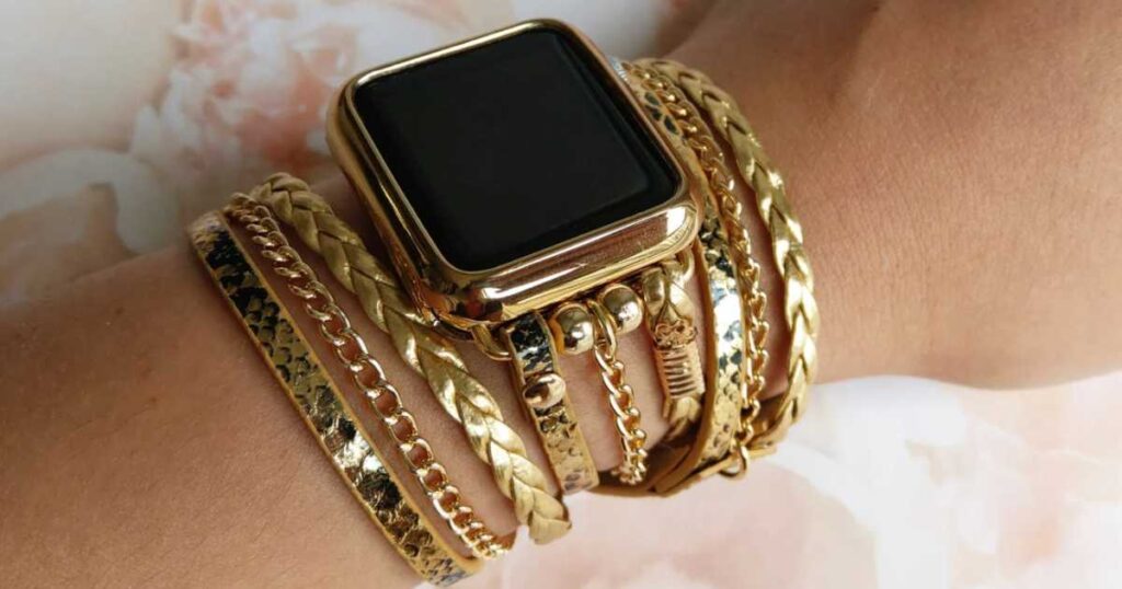 multi-chain gold chain apple watch bracelet on woman's wrist